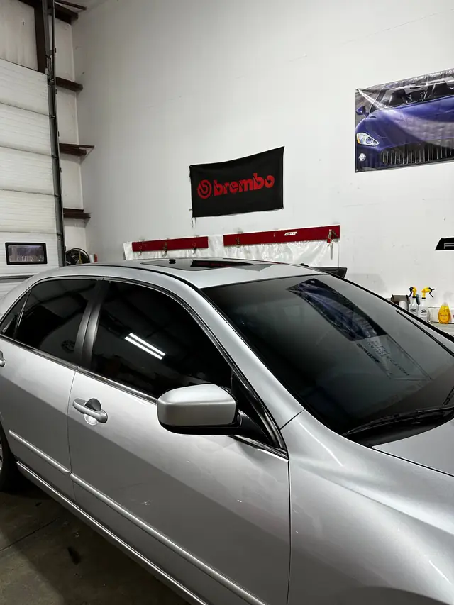 Silver sedan parked in the shop